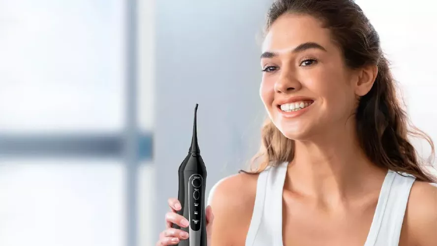 Irrigador dental portátil